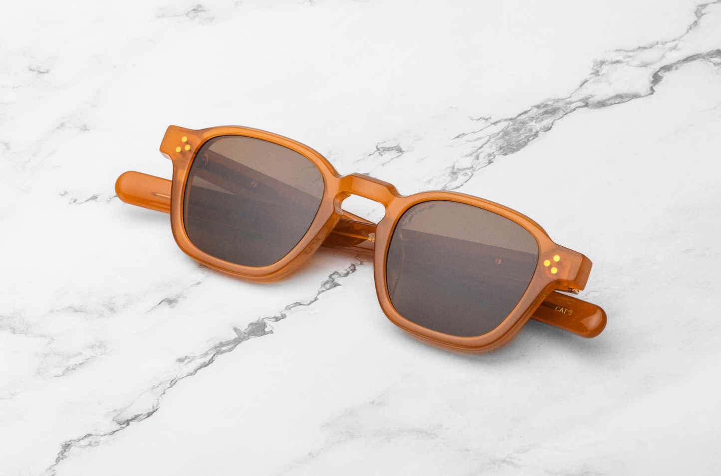 Orange sunglasses with brown lenses