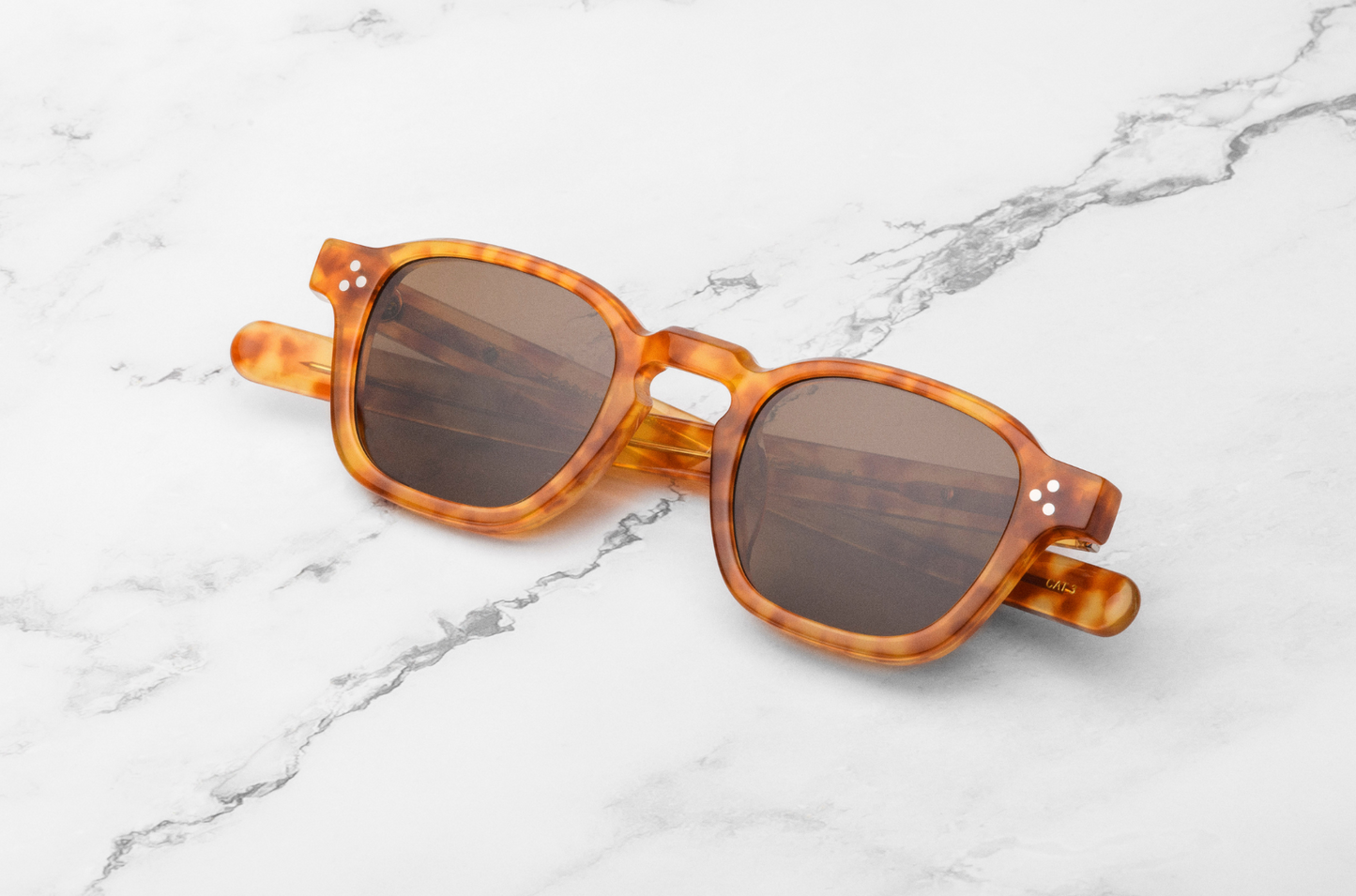 Orange square frame sunglasses with dark lenses