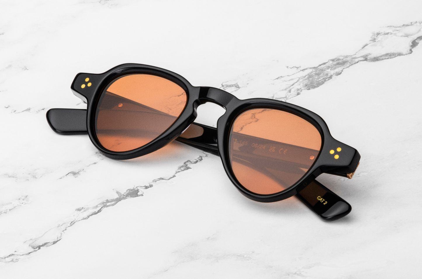 small round sunglasses with orange lenses
