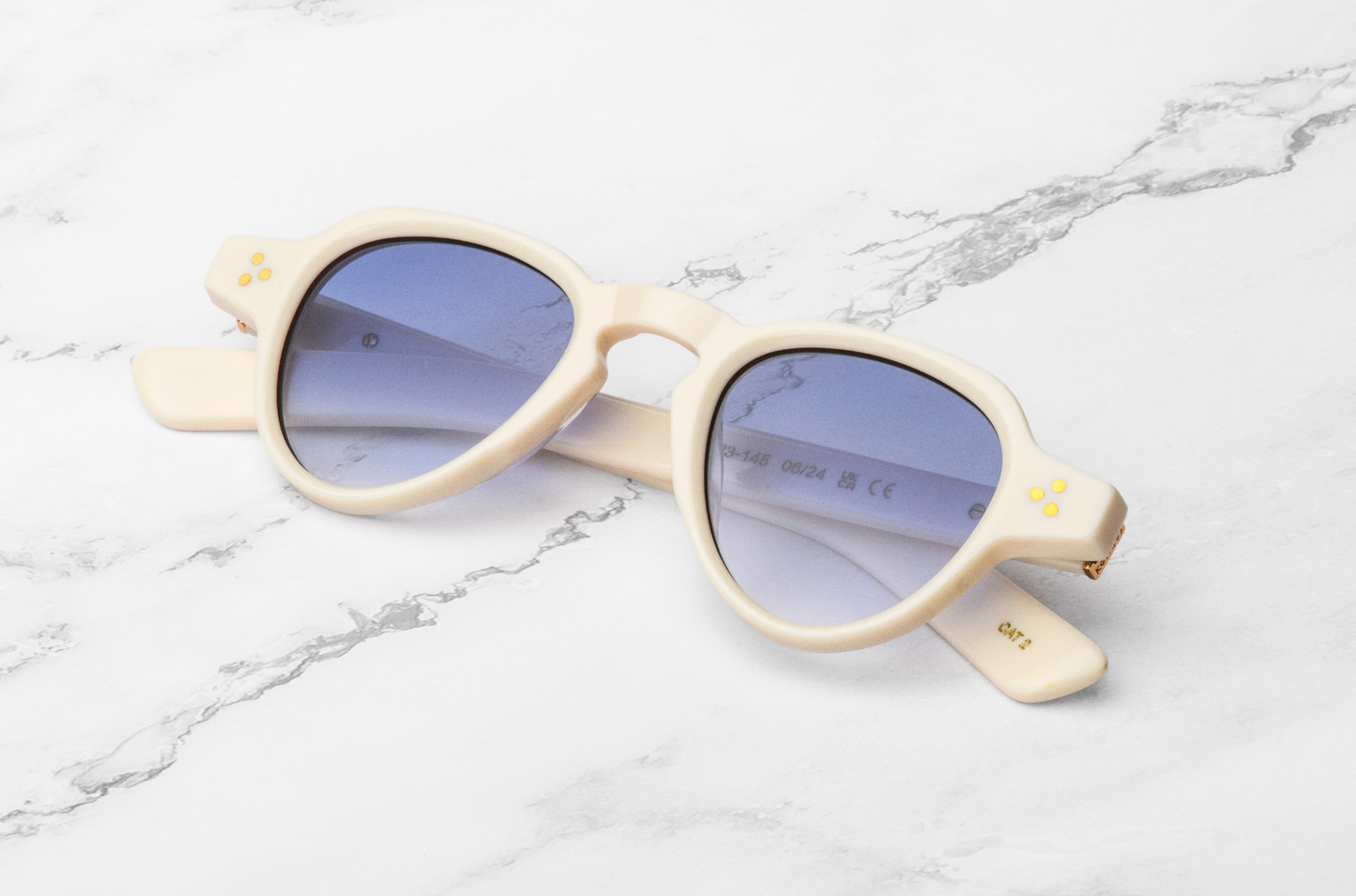 creamy white round sunglasses with blue polarized lenses