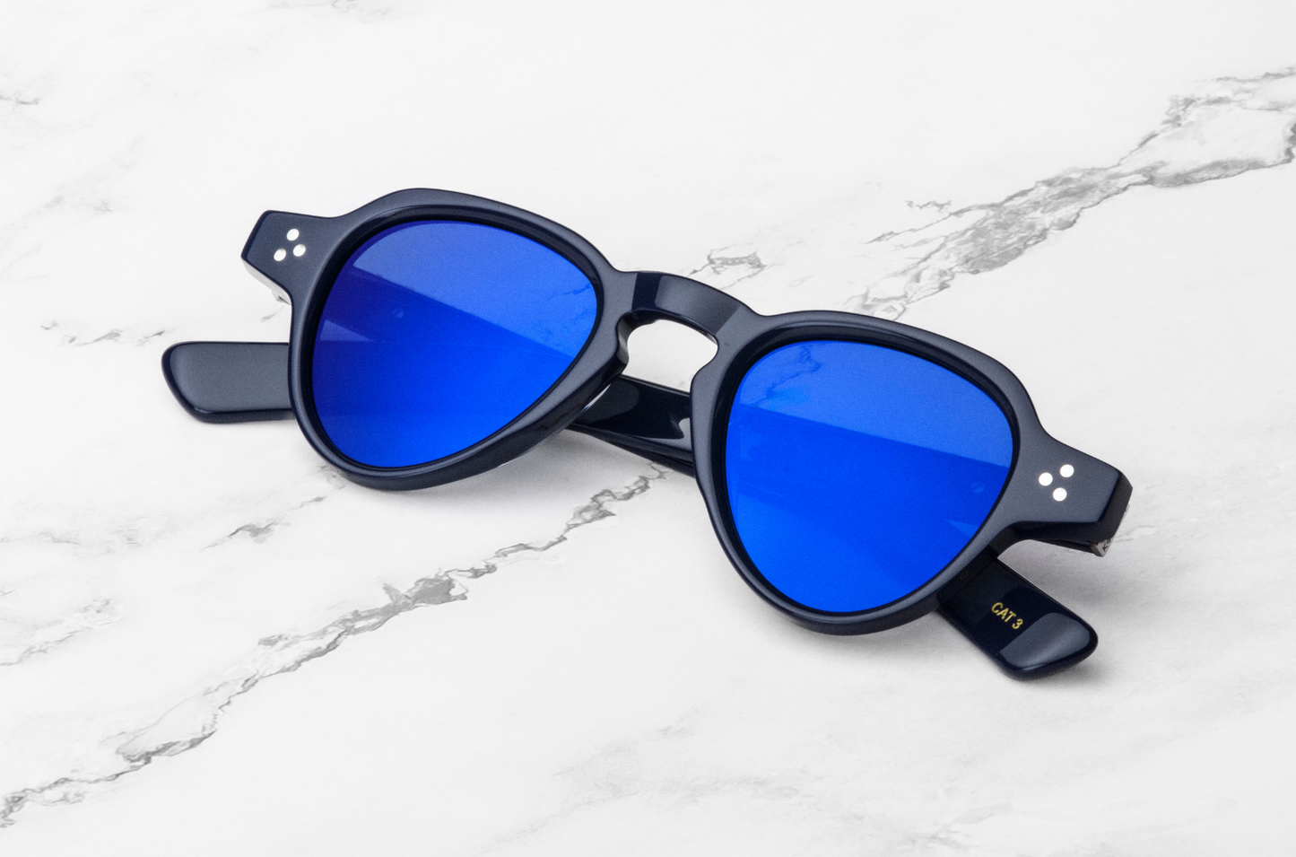 black round sunglasses with blue lenses