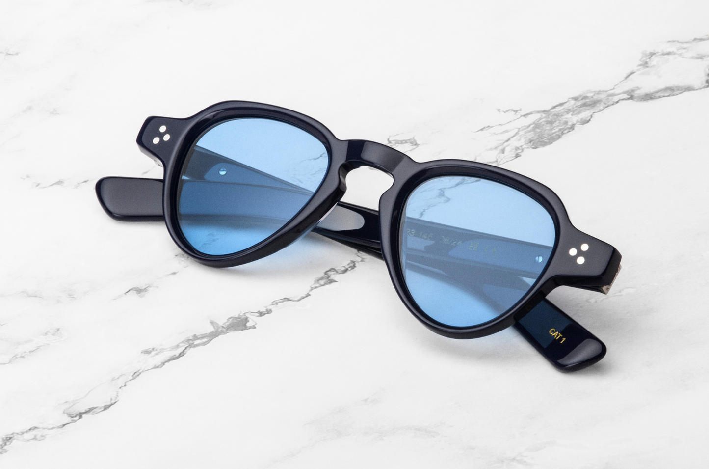 Black round sunglasses with blue lenses
