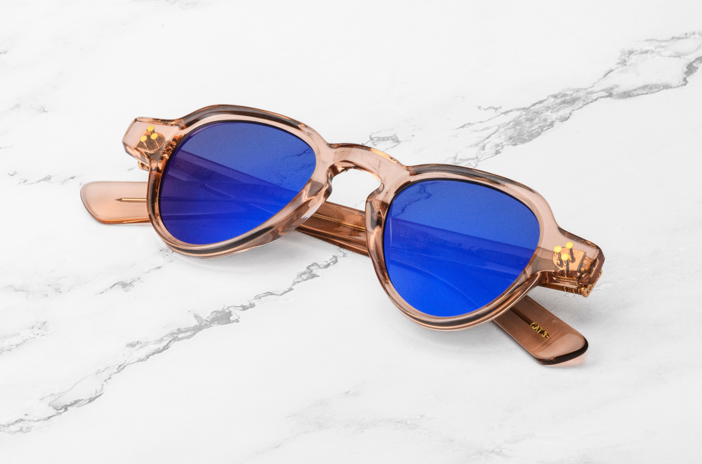 Pink round sunglasses with blue lenses