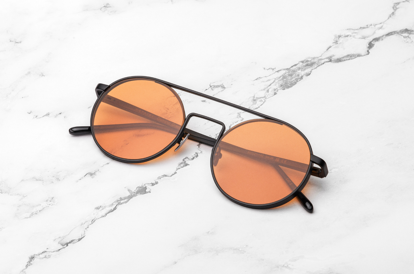 Black round sunglasses with orange polarized lenses by Kopajos