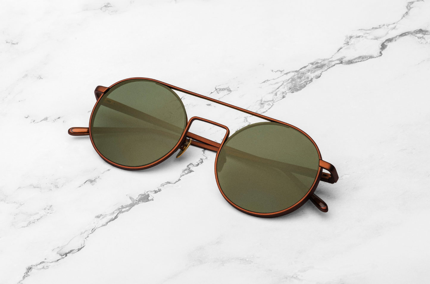 Bronze round sunglasses with green polarized lenses by Kopajos