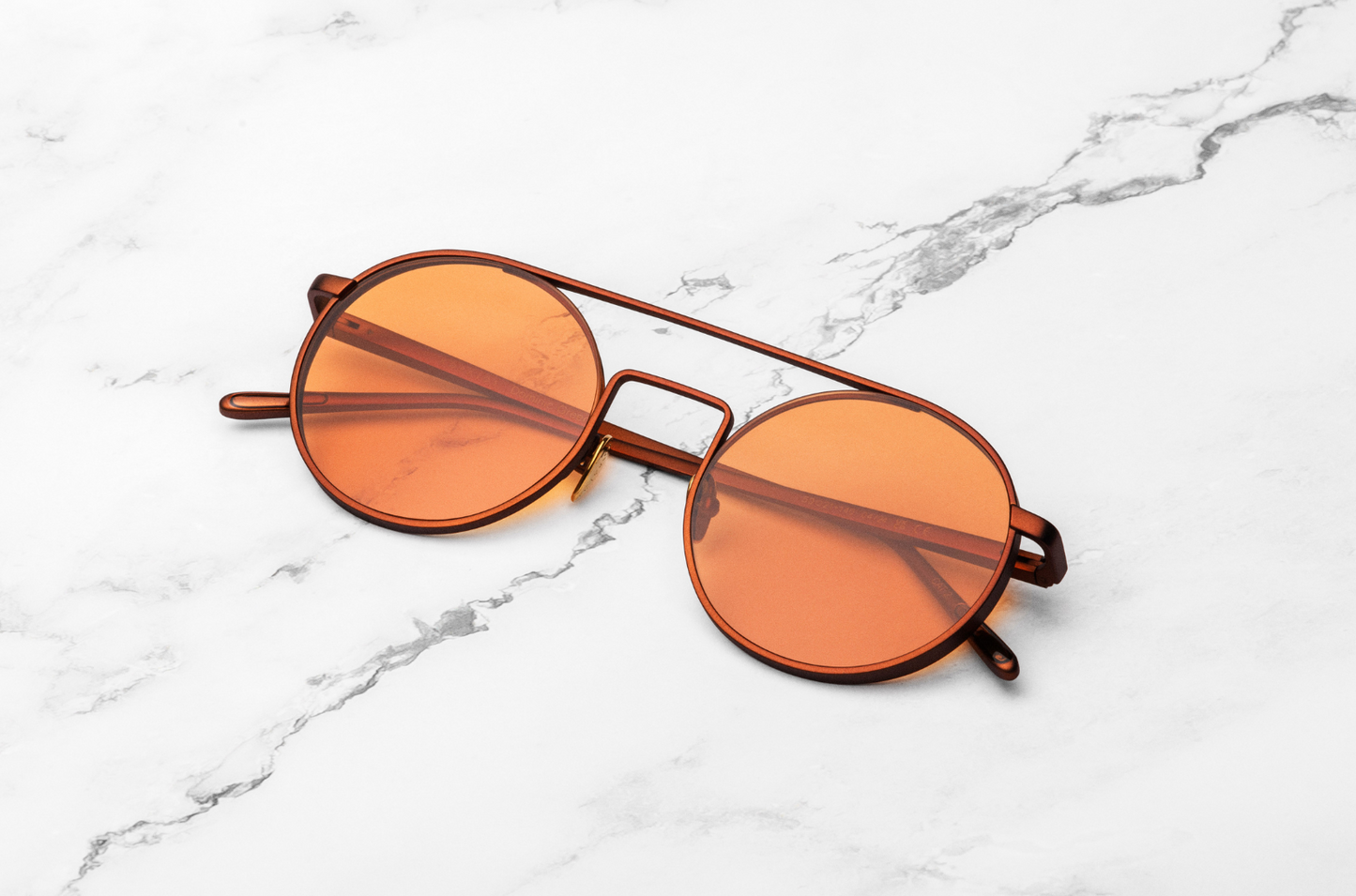 Bronze round sunglasses with orange polarized lenses by Kopajos