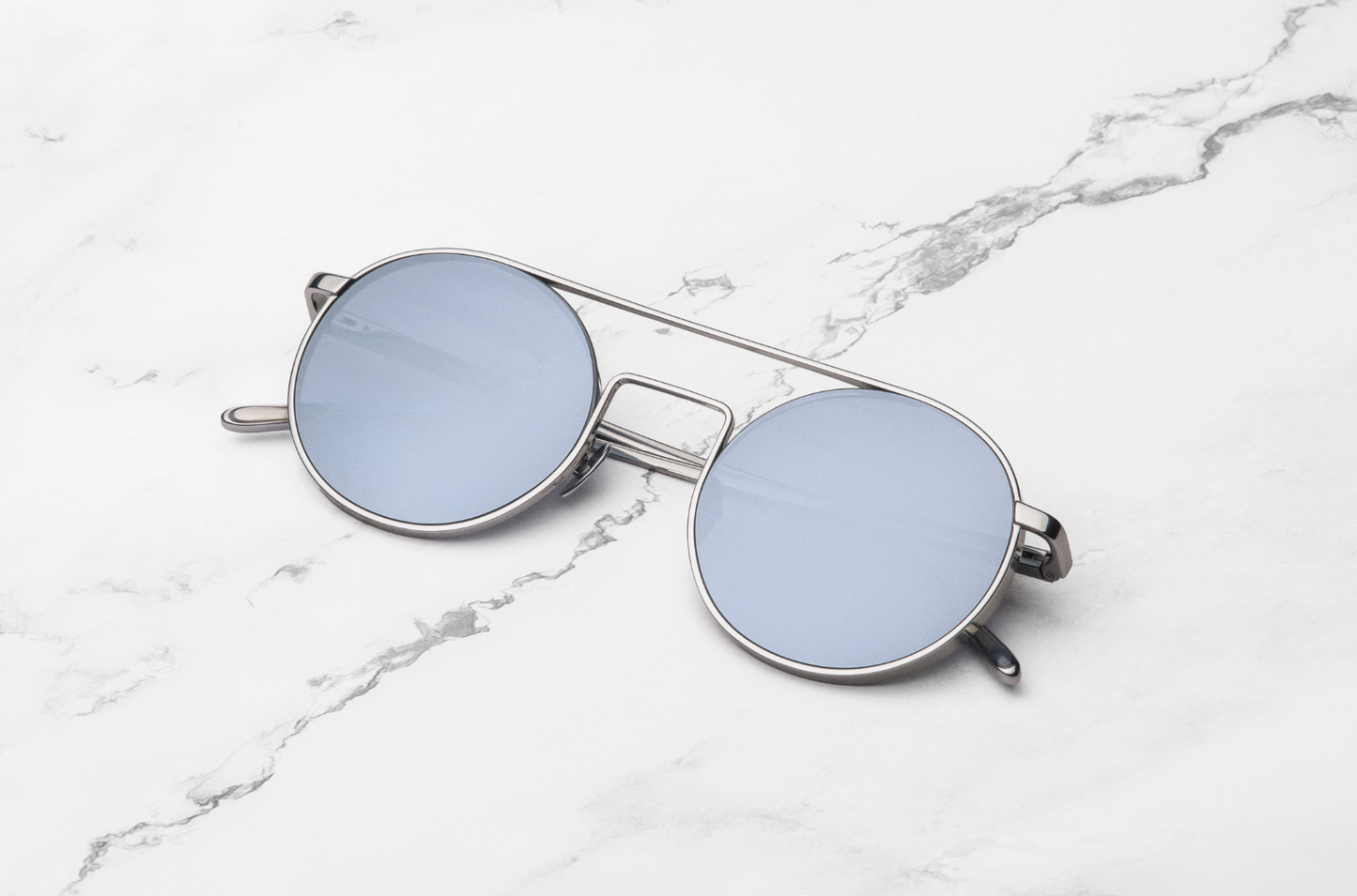 Silver round frame sunglasses with polarized lenses by Kopajos
