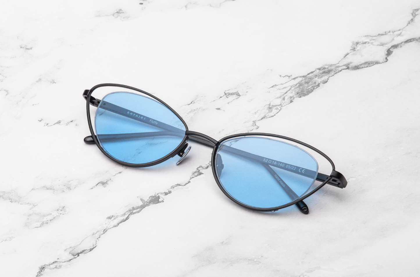 Black cat eye sunglasses for women with light blue lenses