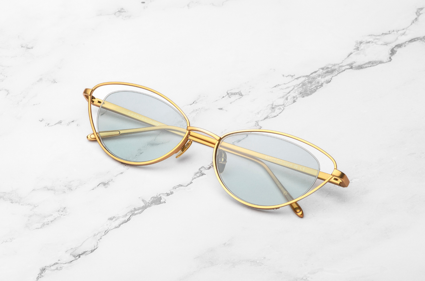 Gold cat eye sunglasses for women with light green lenses