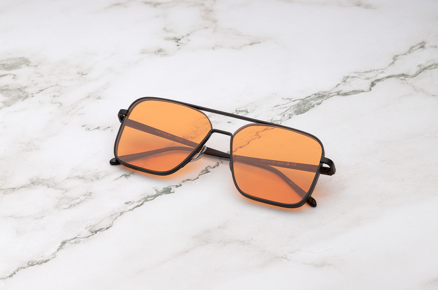 Black aviator sunglasses with orange polarized lenses by Kopajos