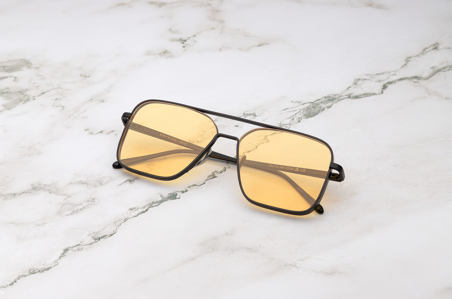 Black aviator sunglasses with yellow polarized lenses by Kopajos