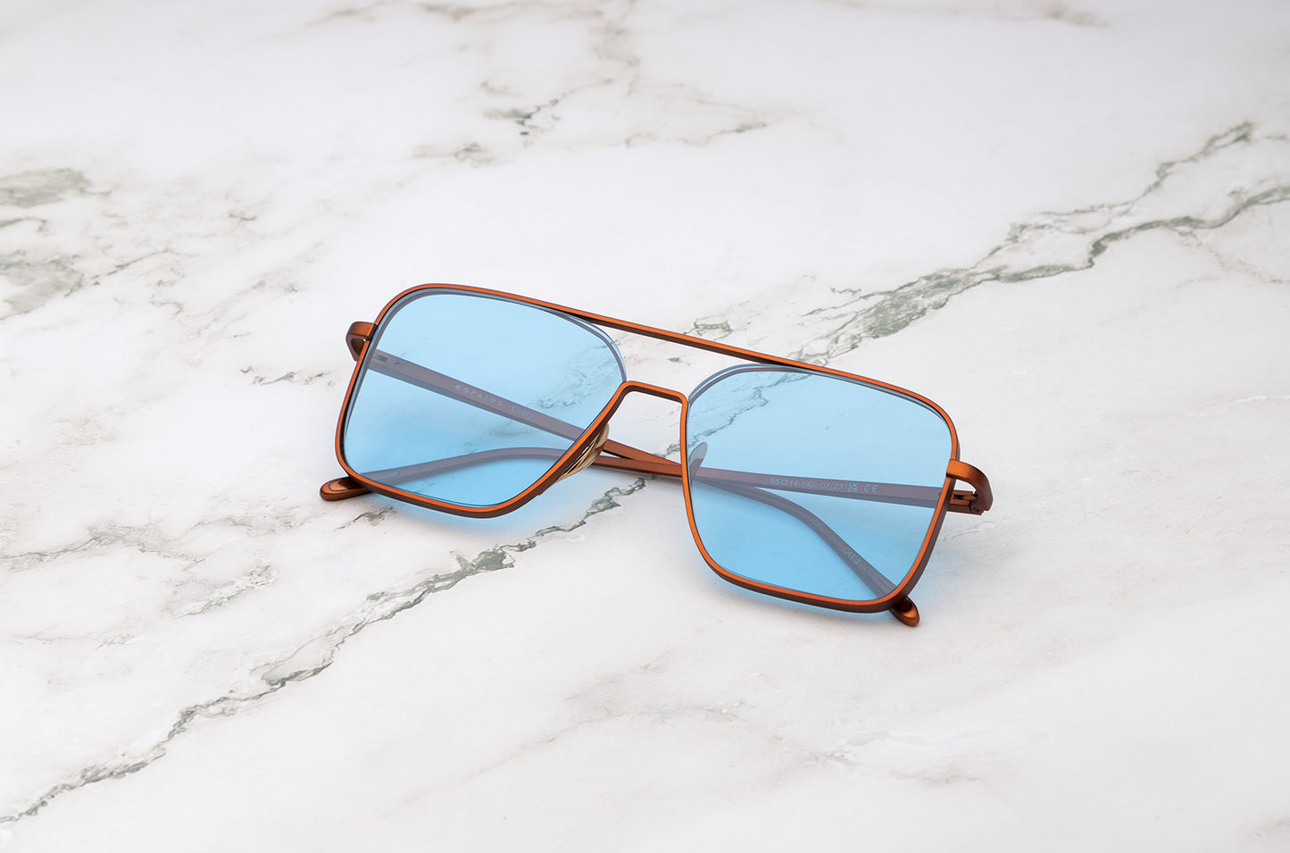 Bronze aviator sunglasses with light blue polarized lenses by Kopajos