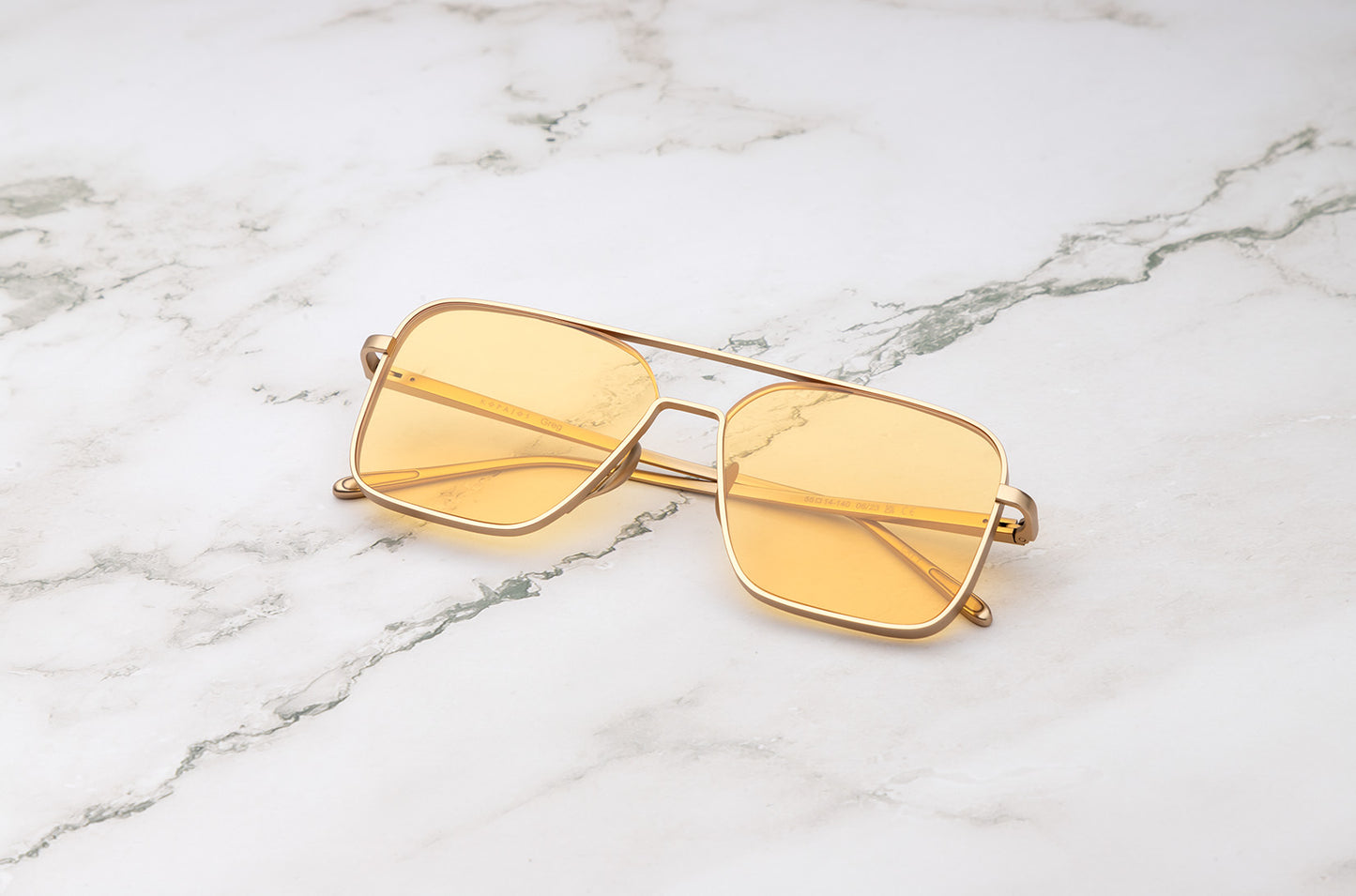 Gold aviator sunglasses with yellow polarized lenses by Kopajos