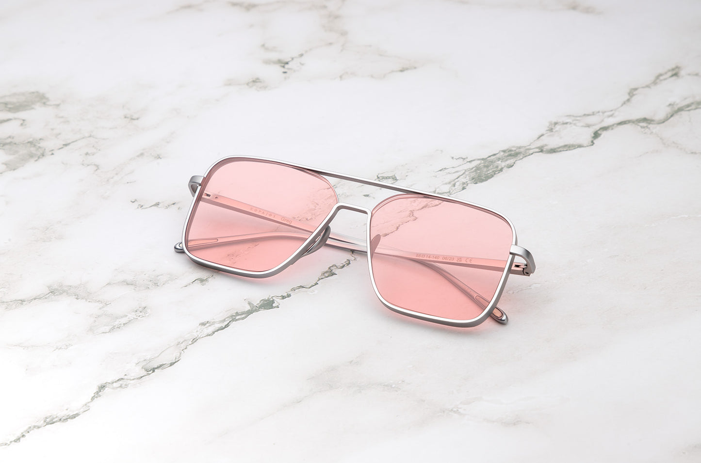 Silver aviator sunglasses with pink polarized lenses by Kopajos