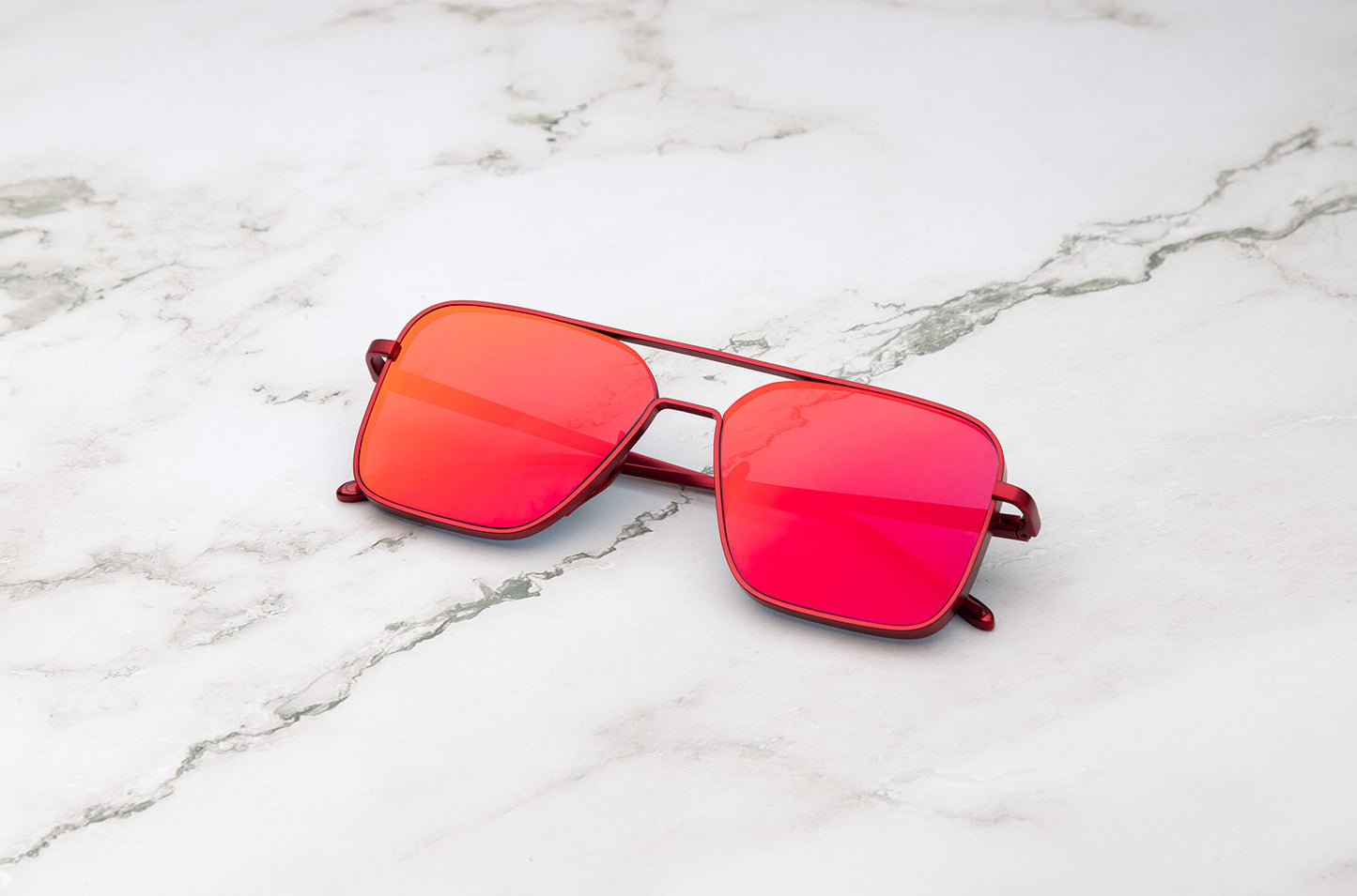 Red aviator sunglasses with mirror polarized lenses by Kopajos