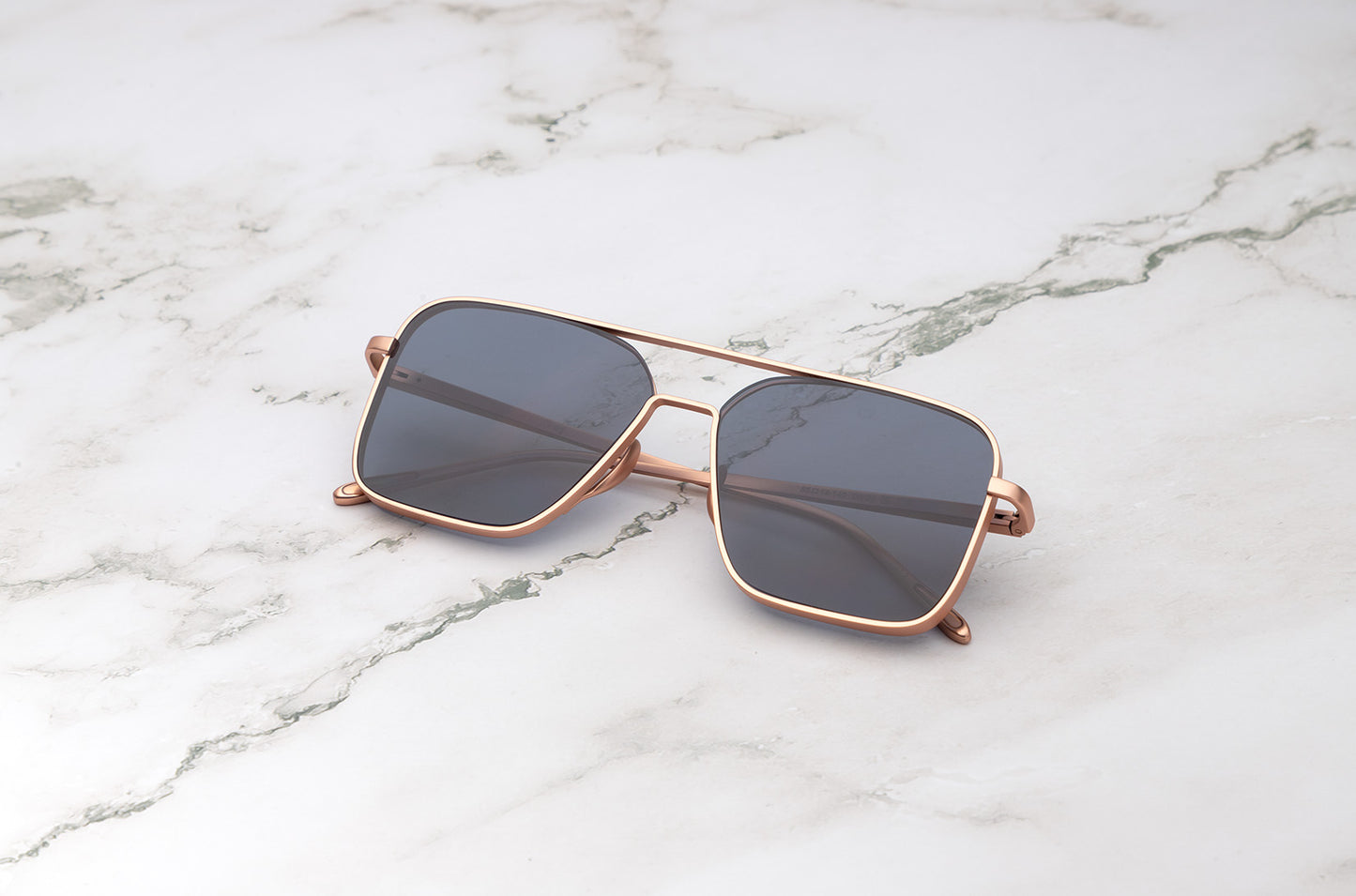 Rose Gold aviator sunglasses with black polarized lenses by Kopajos