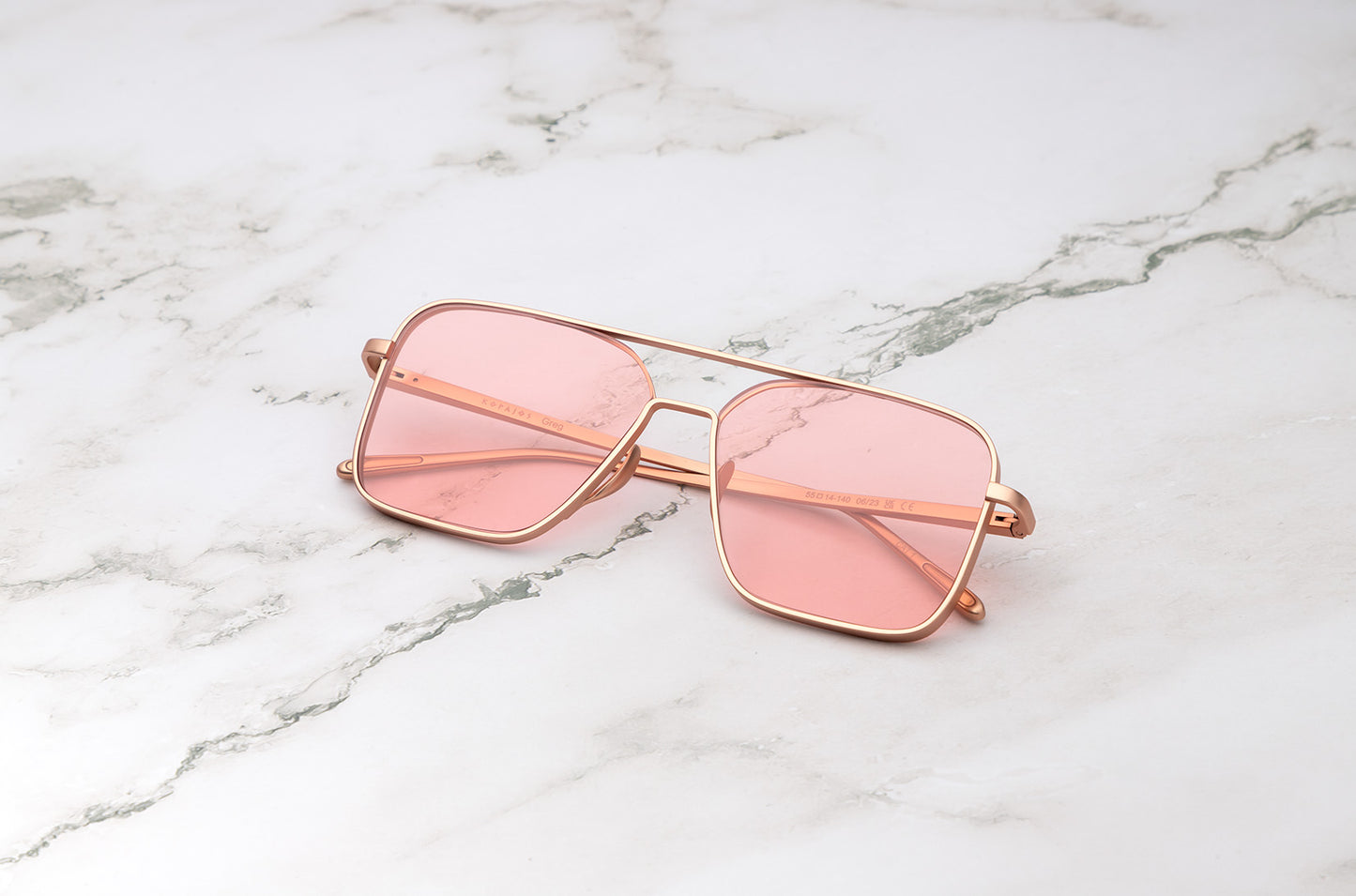 Rose Gold aviator sunglasses with pink polarized lenses by Kopajos