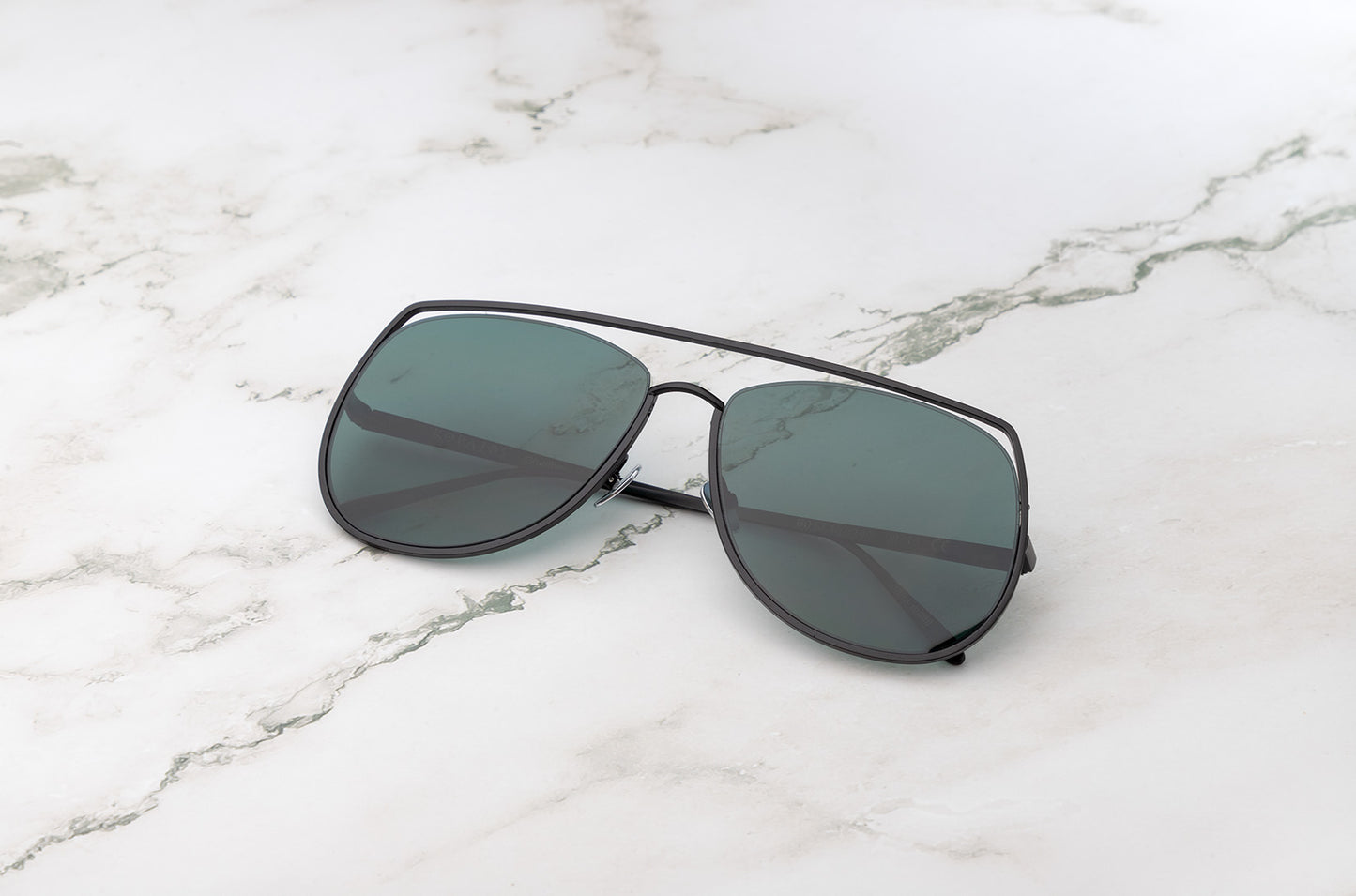 Black aviator sunglasses with green polarized lenses by Kopajos