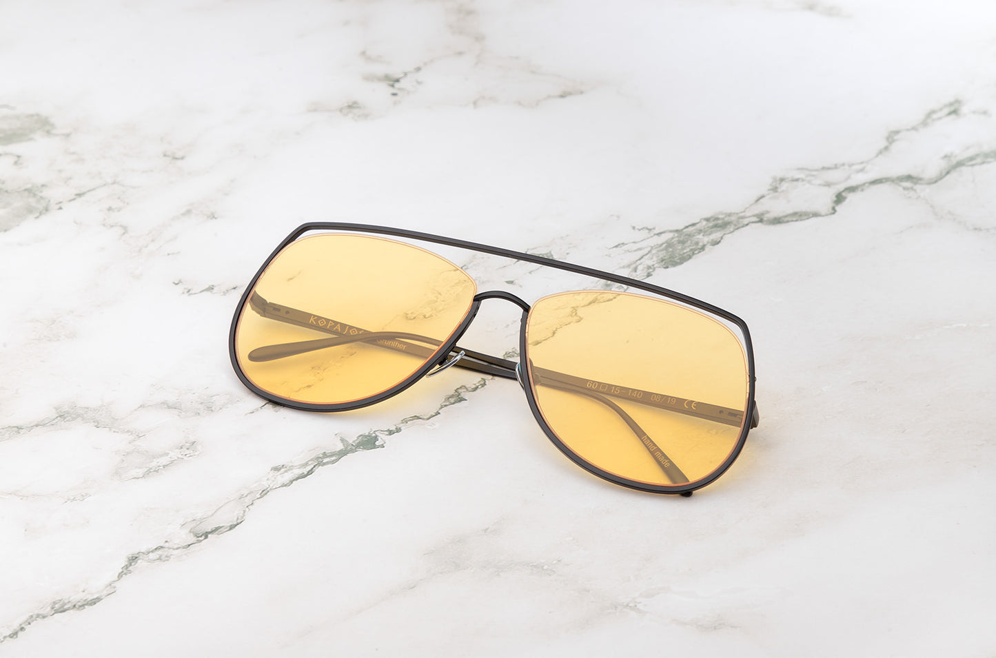 Black aviator sunglasses with yellow polarized lenses by Kopajos