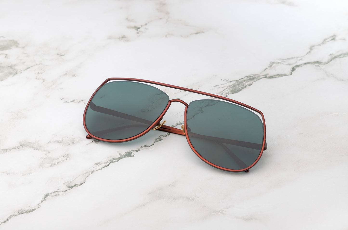 Bronze aviator sunglasses with green polarized lenses by Kopajos