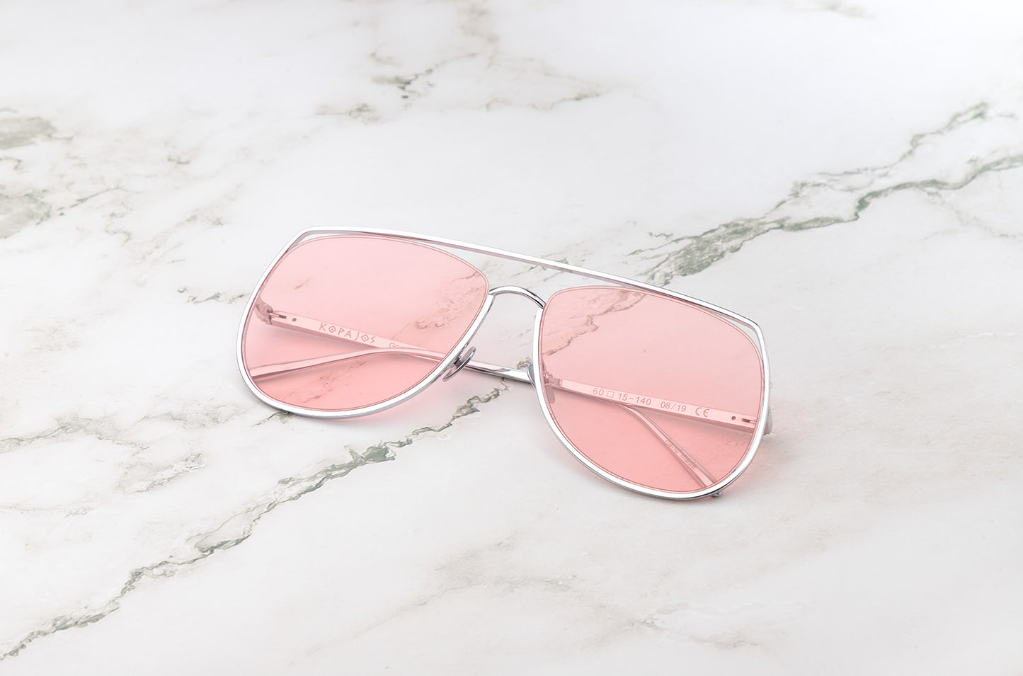 Silver aviator sunglasses with pink polarized lenses by Kopajos
