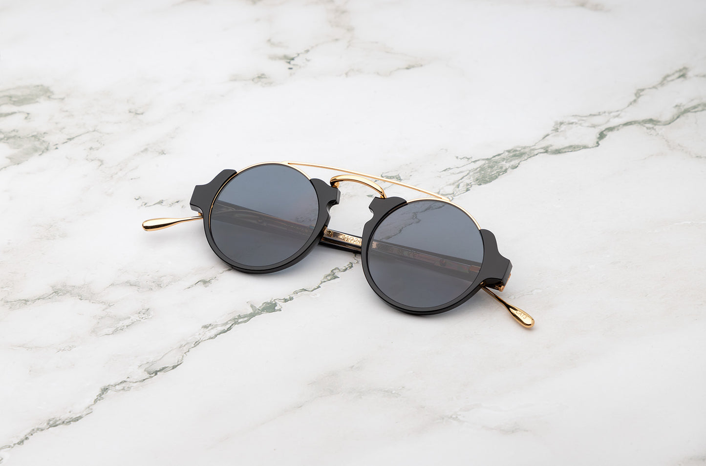 Black and gold round sunglasses for men and women with polarized lenses by Kopajos