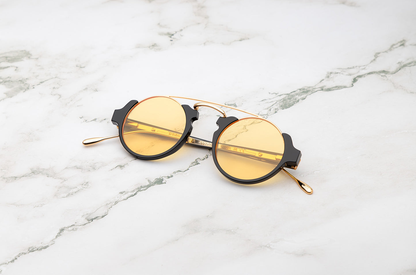 Black round sunglasses for men and women with polarized yellow lenses by Kopajos