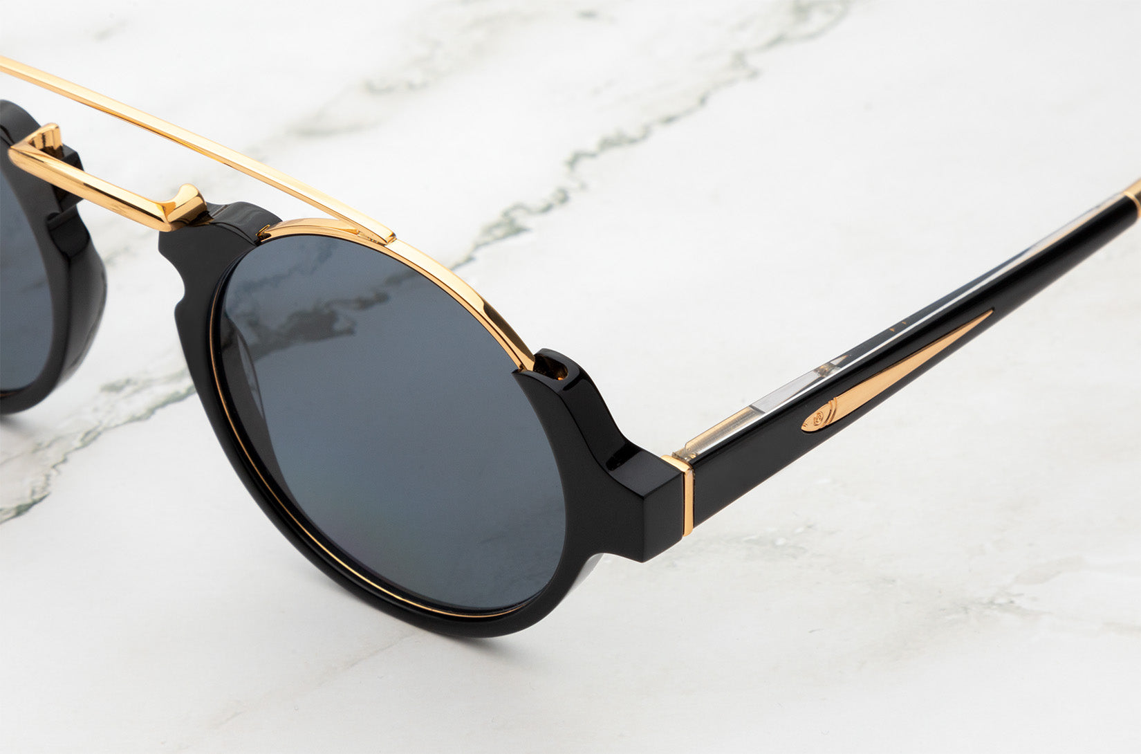 Isabella round sunglasses with gold details by Kopajos