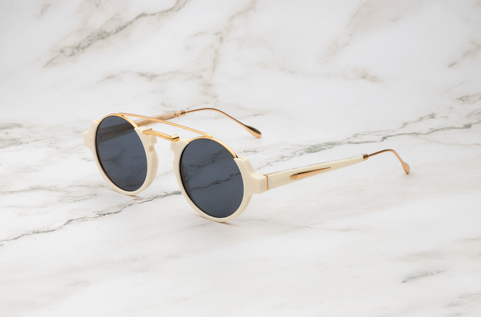 White round sunglasses with black polarized lenses by Kopajos