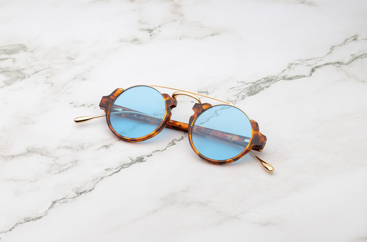 Tortoise round sunglasses for men with polarized light blue lenses by Kopajos