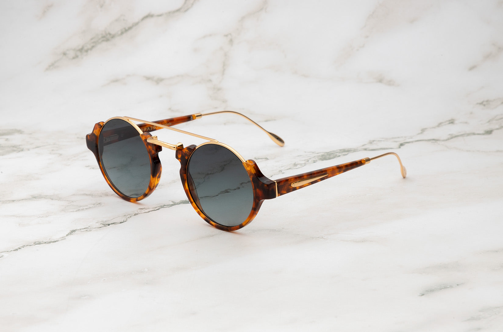 Tortoise round sunglasses for women with dark polarized lenses by Kopajos
