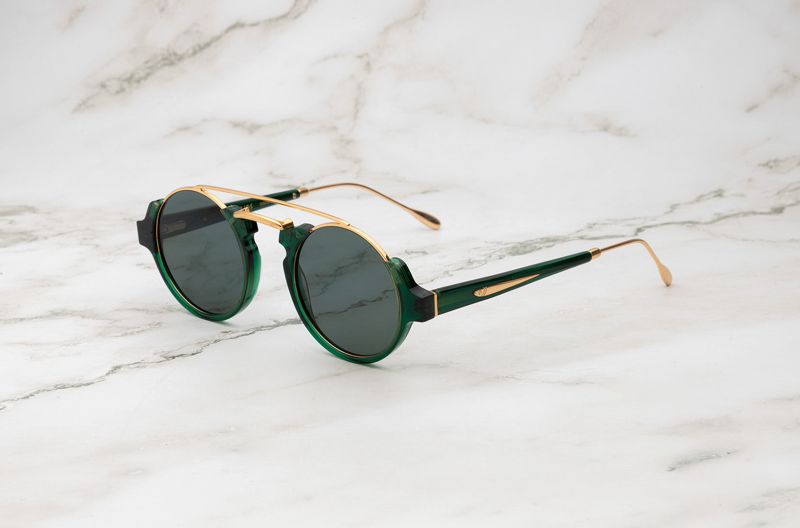 Green round sunglasses with black polarized lenses by Kopajos
