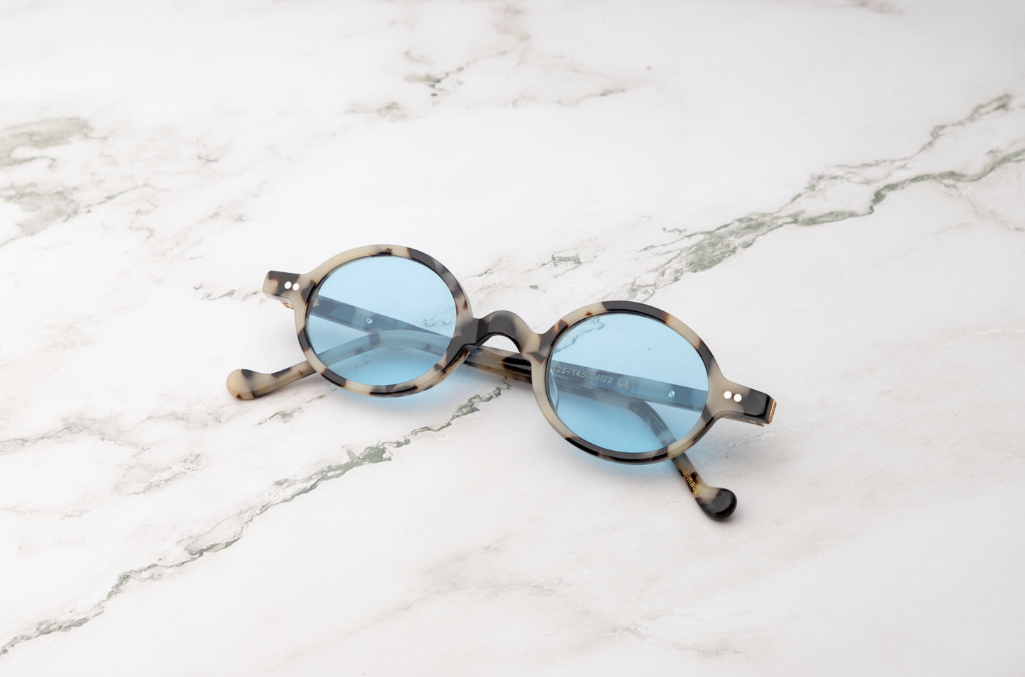 Leopard round sunglasses for women with light blue polarized lenses by Kopajos