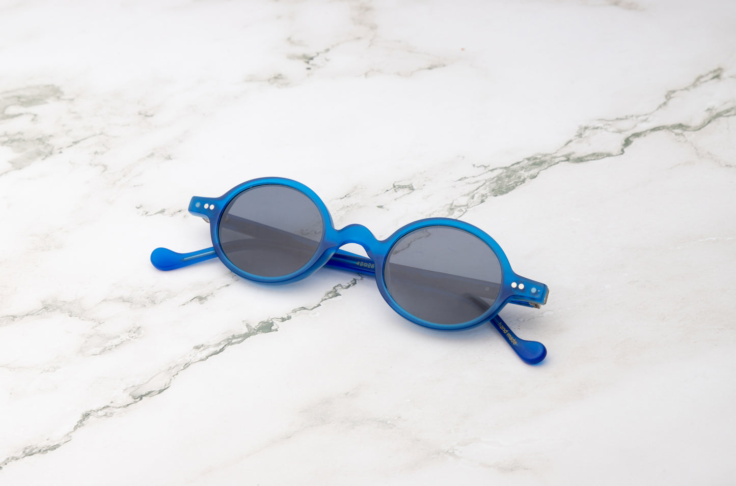 Blue round sunglasses with black polarized lenses by Kopajos
