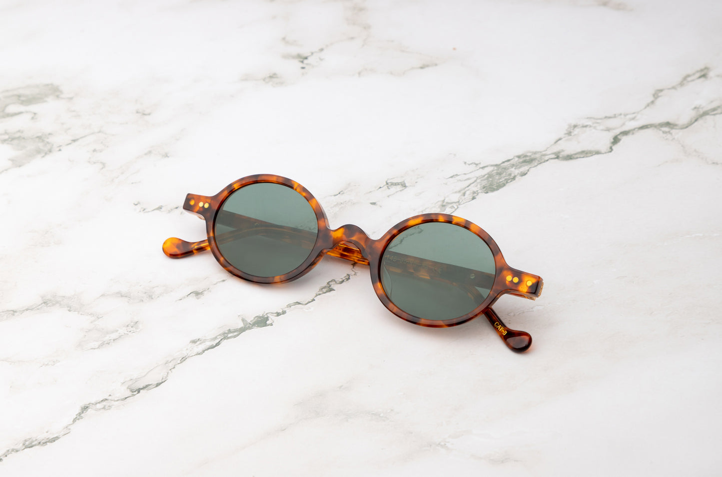 Tortoiseshell round sunglasses with polarized lenses by Kopajos