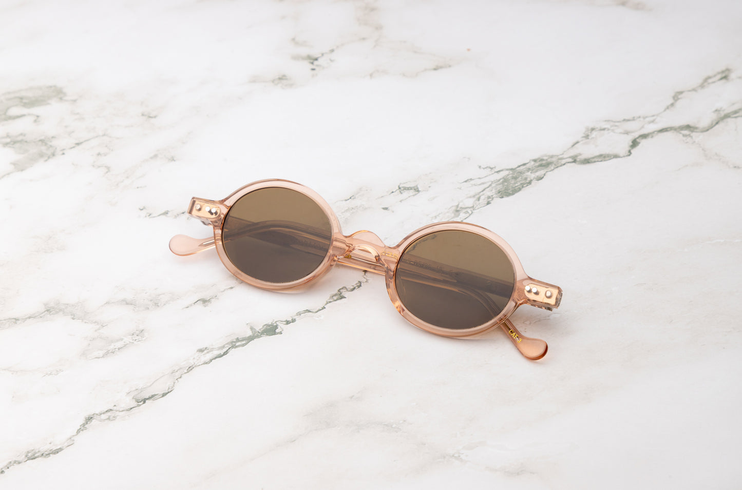 Pink round sunglasses for women with brown polarized lenses by Kopajos
