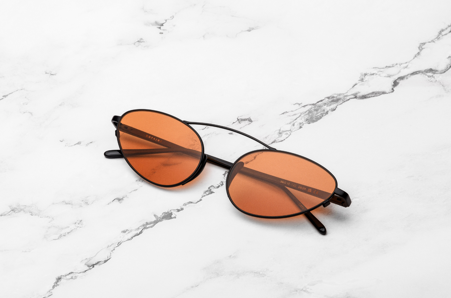 Black female cat eye sunglasses with orange polarized lenses, Kopajos
