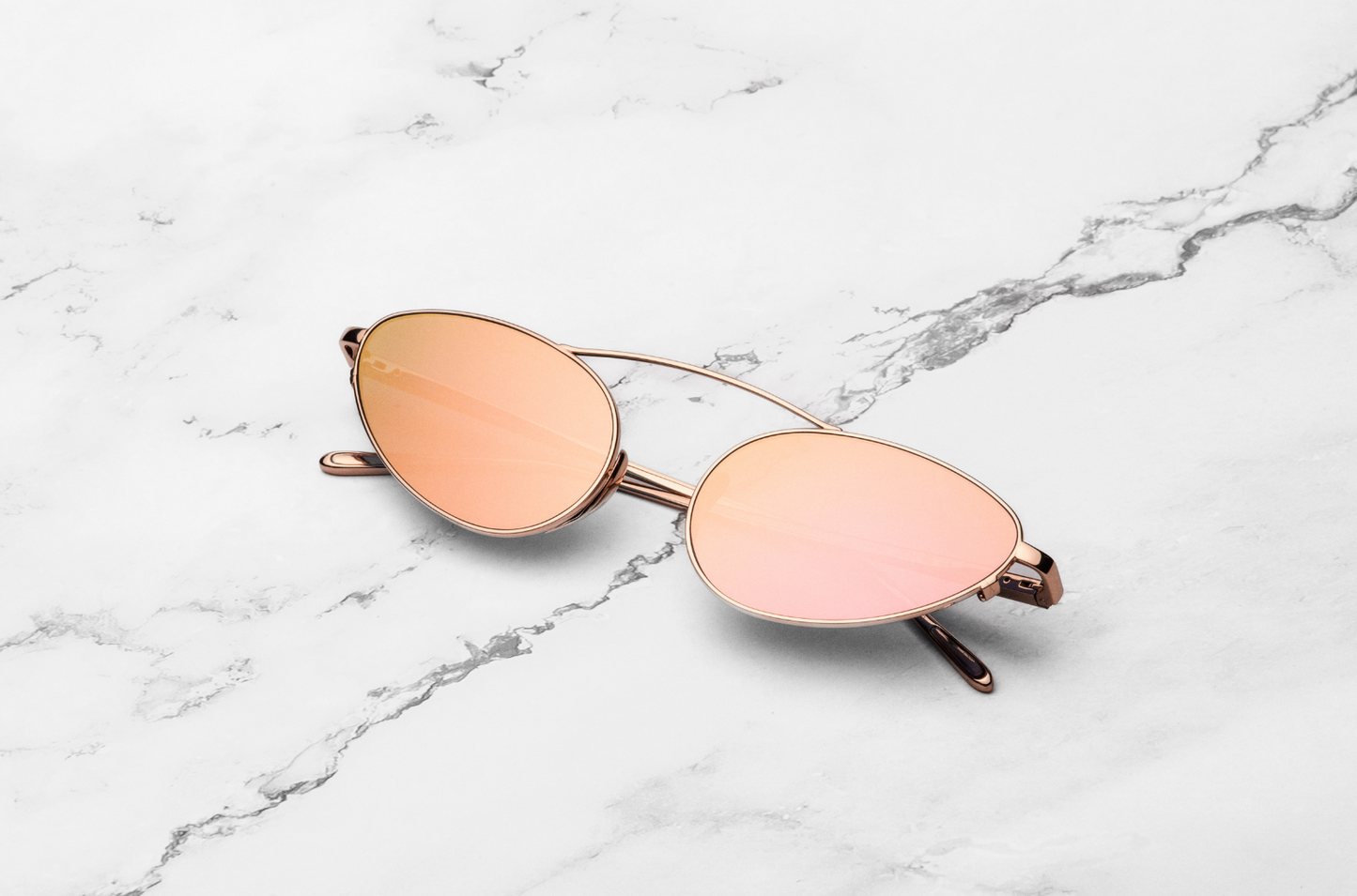 Rose gold female cat eye sunglasses with mirror lenses