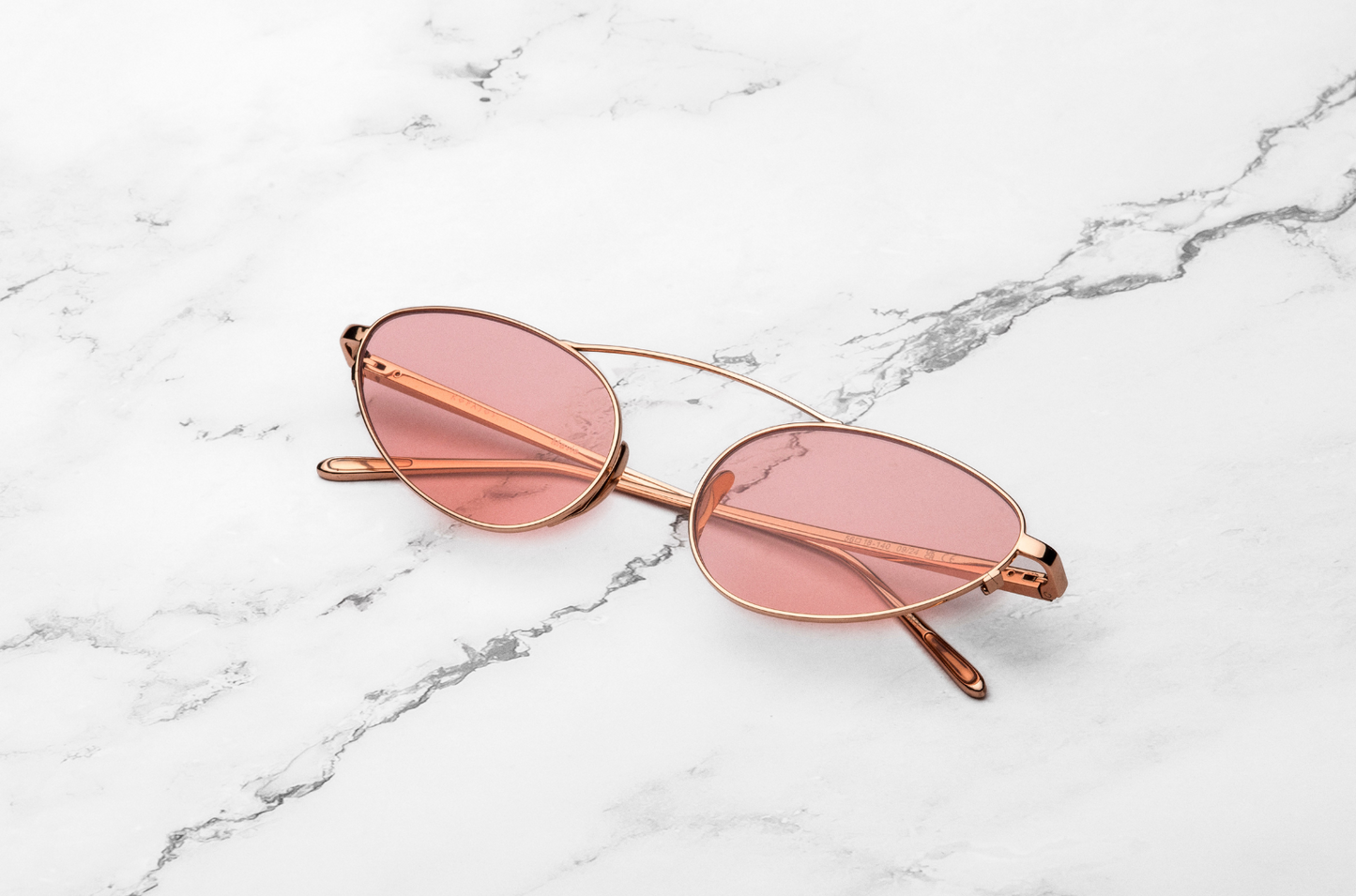 Rose gold female cat eye sunglasses with pink lenses, by Kopajos