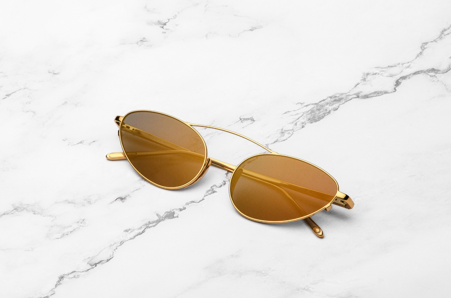 Gold female cat eye sunglasses with mirror lenses