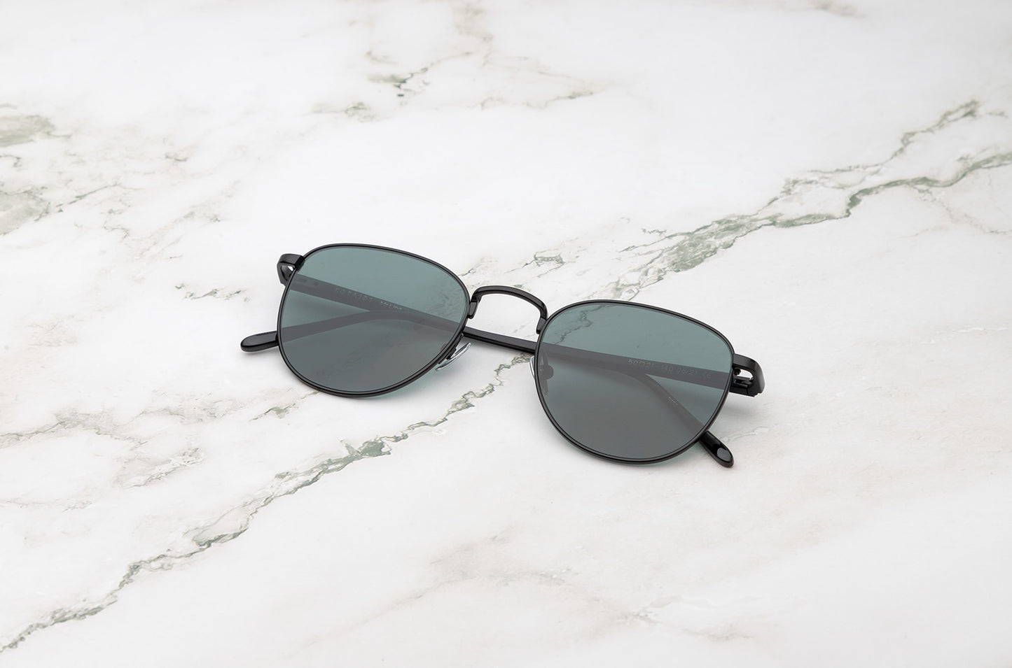 Black aviator sunglasses with dark green polarized lenses by Kopajos