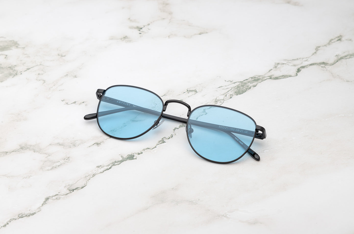 Black aviator sunglasses with ligt blue polarized lenses by Kopajos