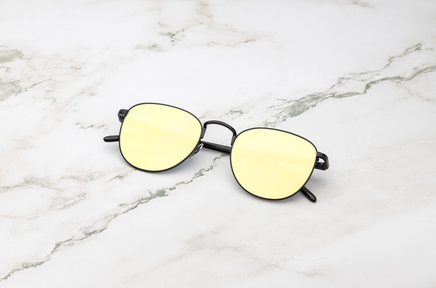 Black aviator sunglasses with yellow mirror lenses by Kopajos