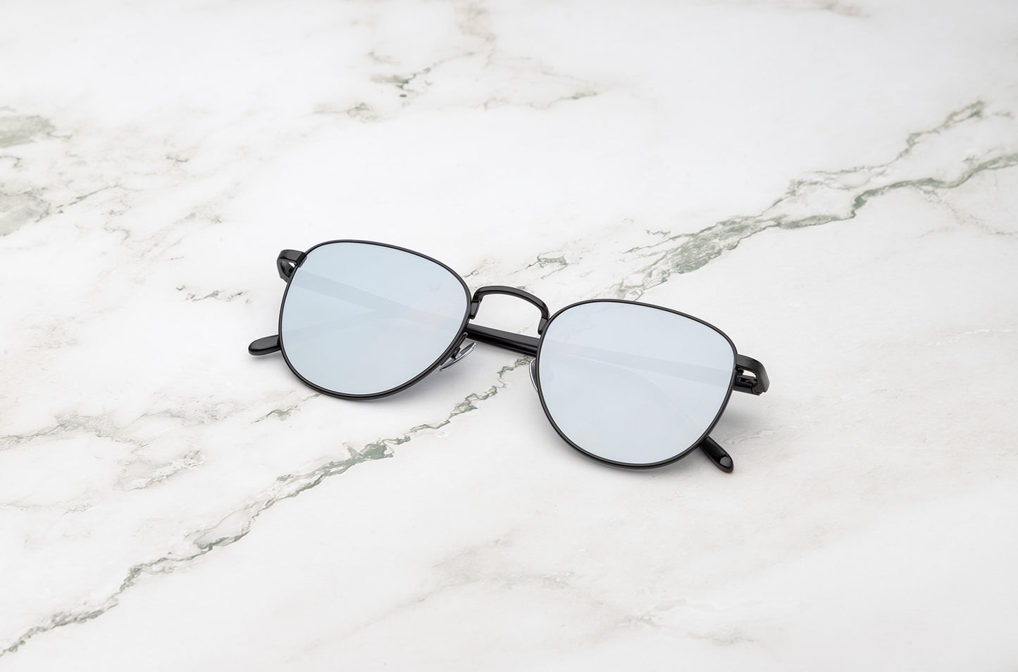 Black aviator sunglasses with silver mirror lenses by Kopajos