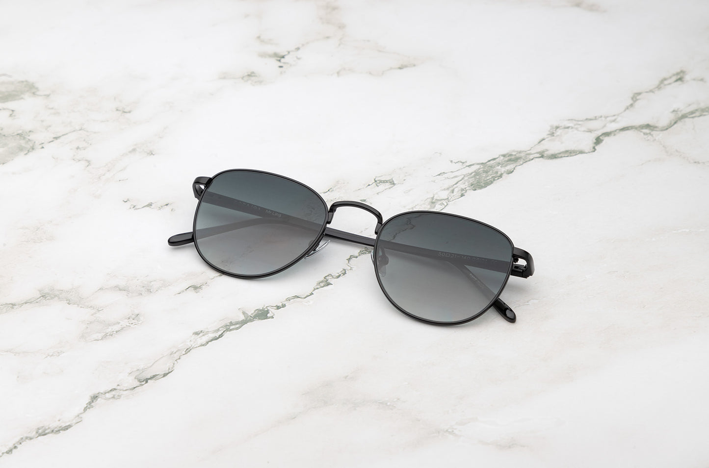Black aviator sunglasses with smokey green lenses by Kopajos
