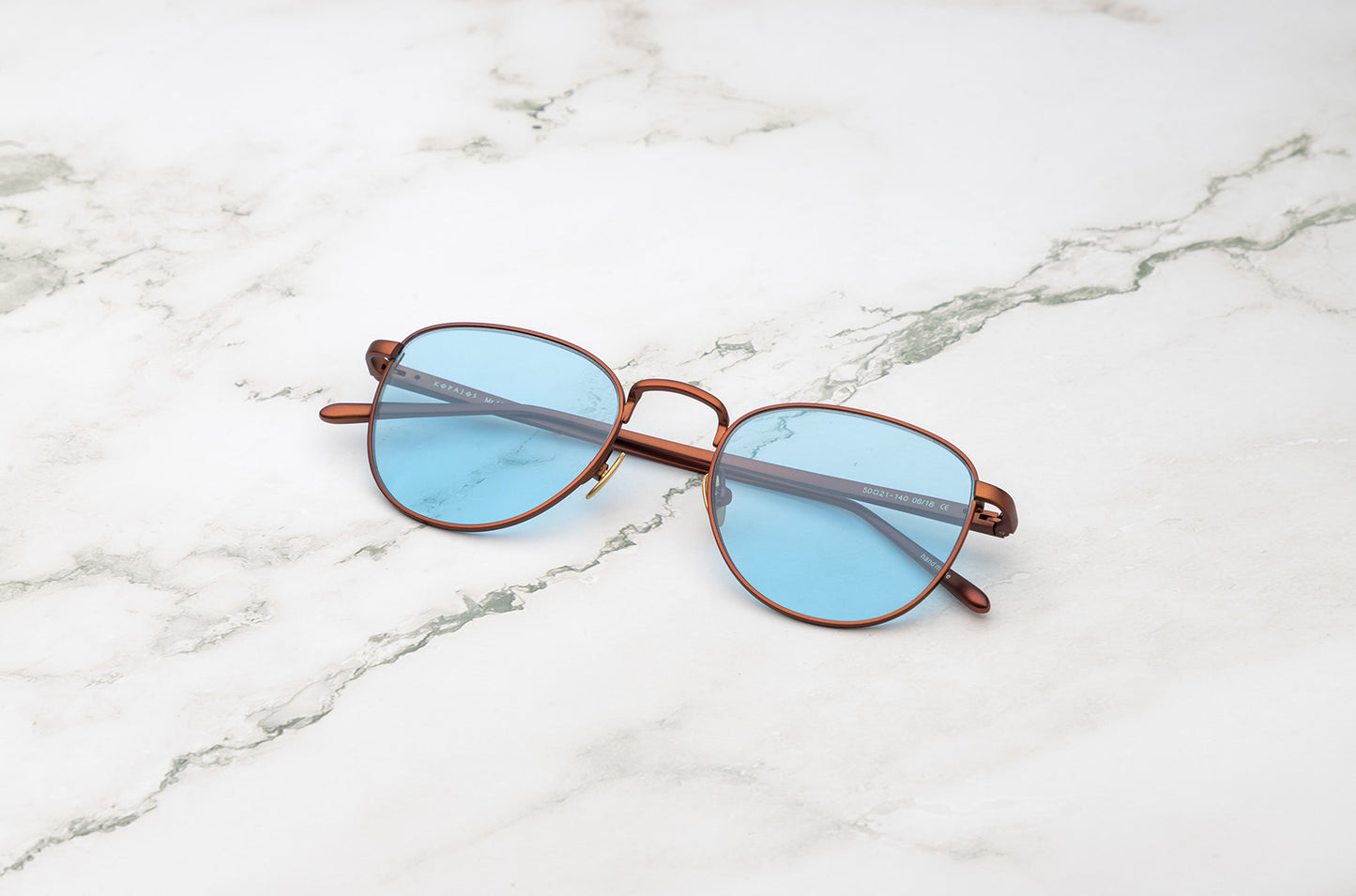 Bronze aviator sunglasses with light blue polarized lenses by Kopajos