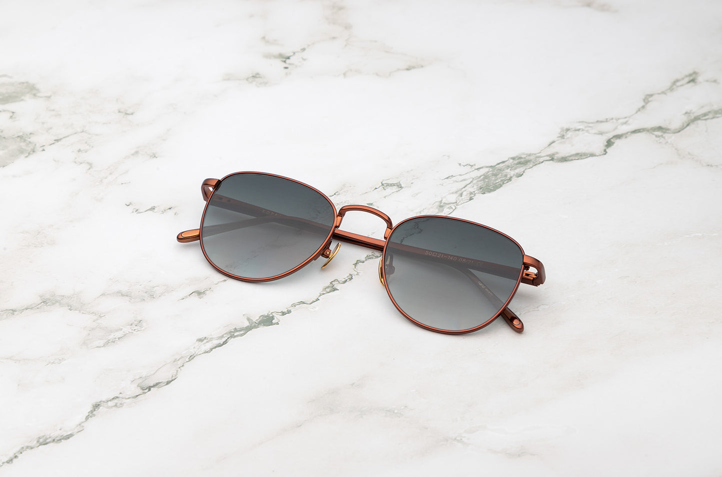 Bronze aviator sunglasses with dark polarized lenses by Kopajos