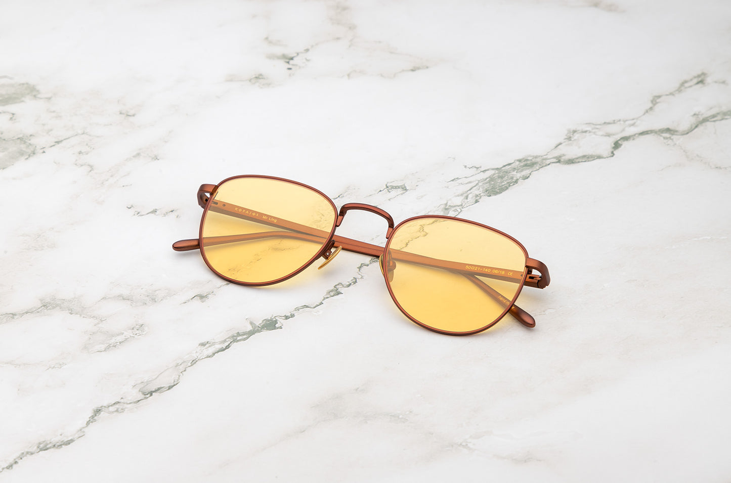 Bronze aviator sunglasses with yellow polarized lenses by Kopajos
