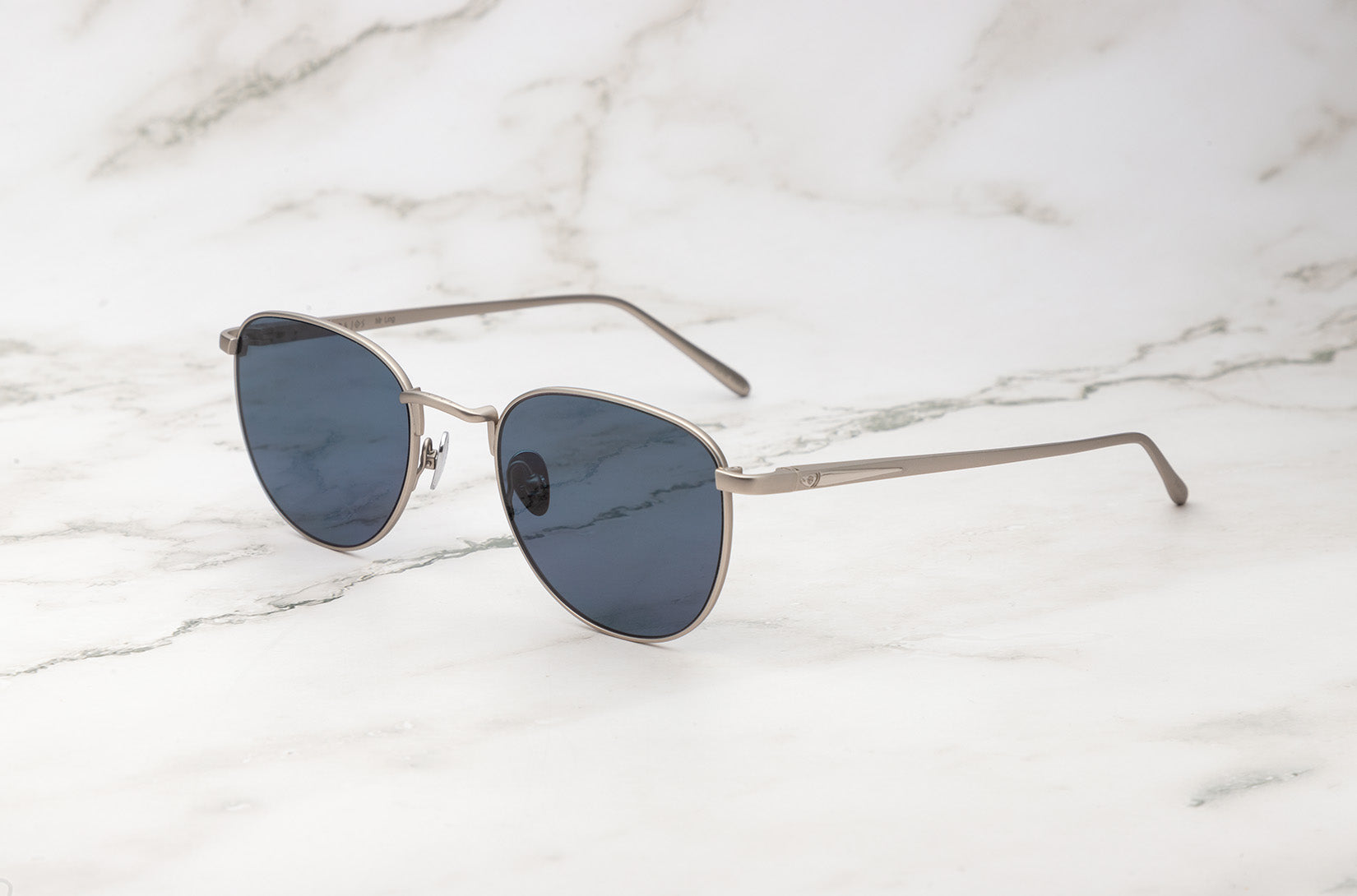Silver aviator sunglasses with dark polarized lenses by Kopajos