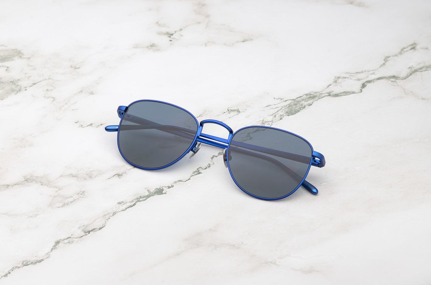 Blue aviator sunglasses with dark polarized lenses by Kopajos